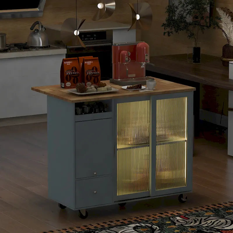 Carrito de isla de cocina con luces LED, barra de desayuno con ala abatible y ruedas, armario bar con 2 cajones, 2 puertas de vidrio y 1 compartimento abatible